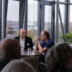 Client Executive David Crillesen in conversation with an investor at the quarterly event