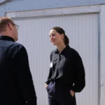 Client Executive Lea Jensen in conversation with an investor at the quarterly event